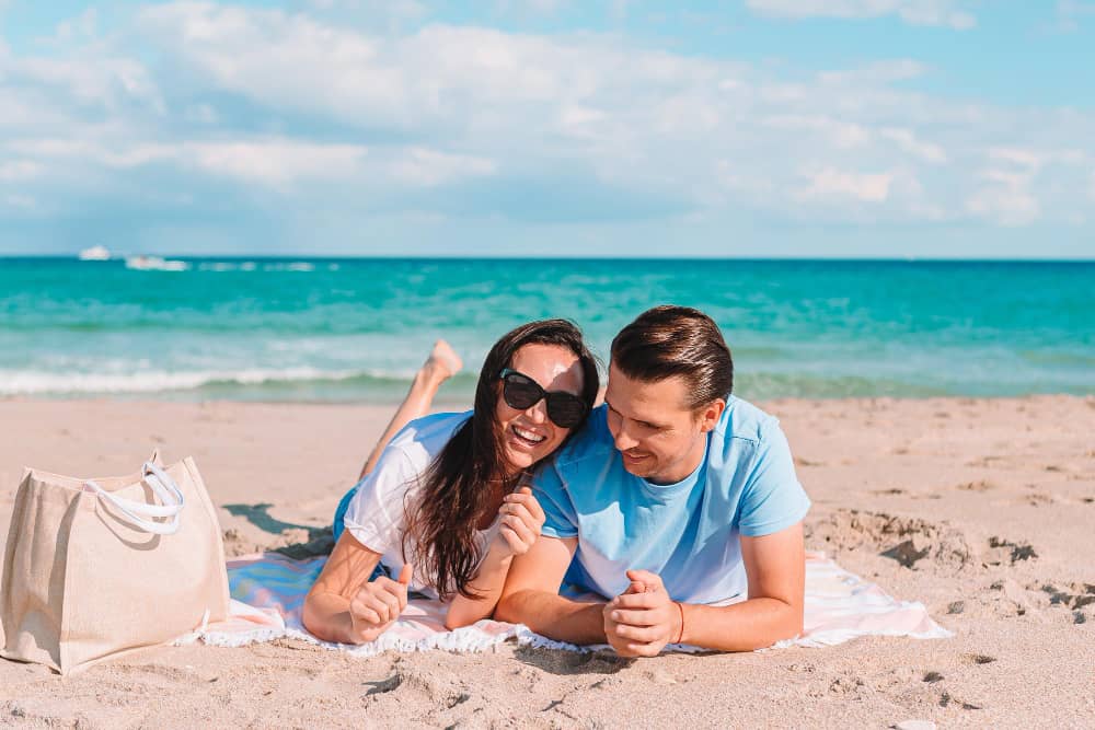 Relax couple lay down beach chairs to enjoy life